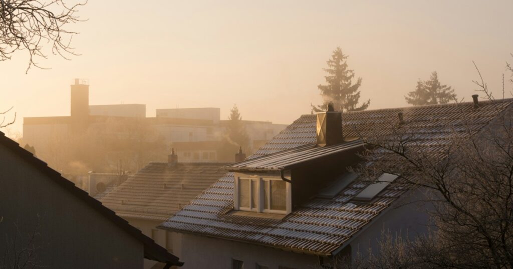 First light over frosted rooftops in a quiet neighbourhood at dawn