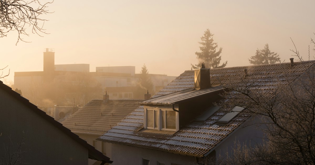 First light over frosted rooftops in a quiet neighbourhood at dawn