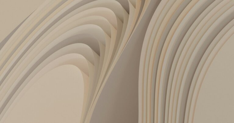 Layered cream and sand coloured curves folding back on themselves