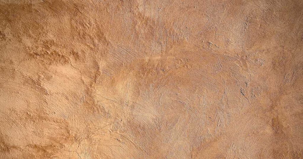 A warm earthy plaster wall worked over with a trowel