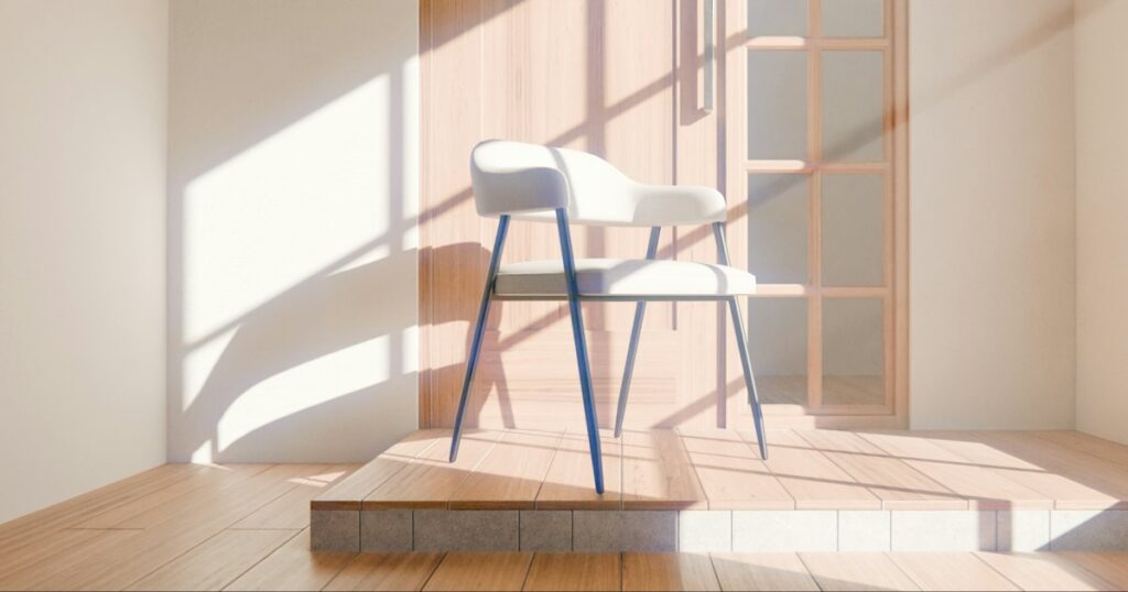 An empty pale chair standing in a patch of morning sunlight in a quiet warm room